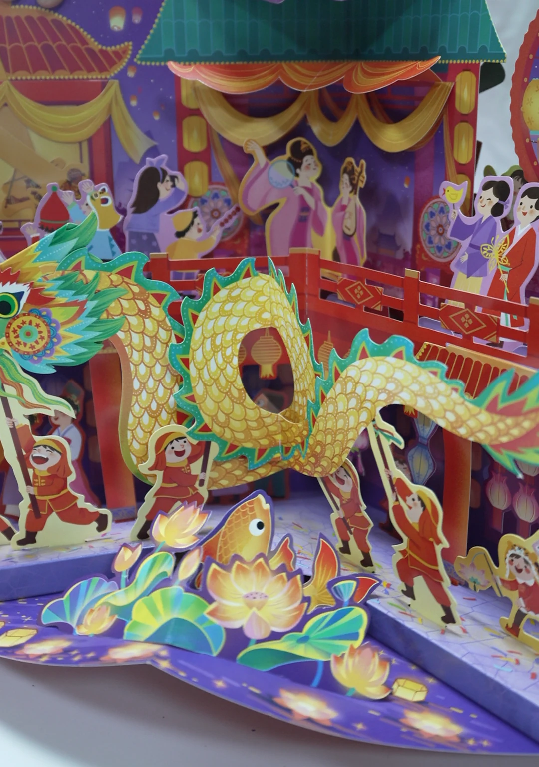 Close view of layered illustrated panels in an expanded carousel book.
